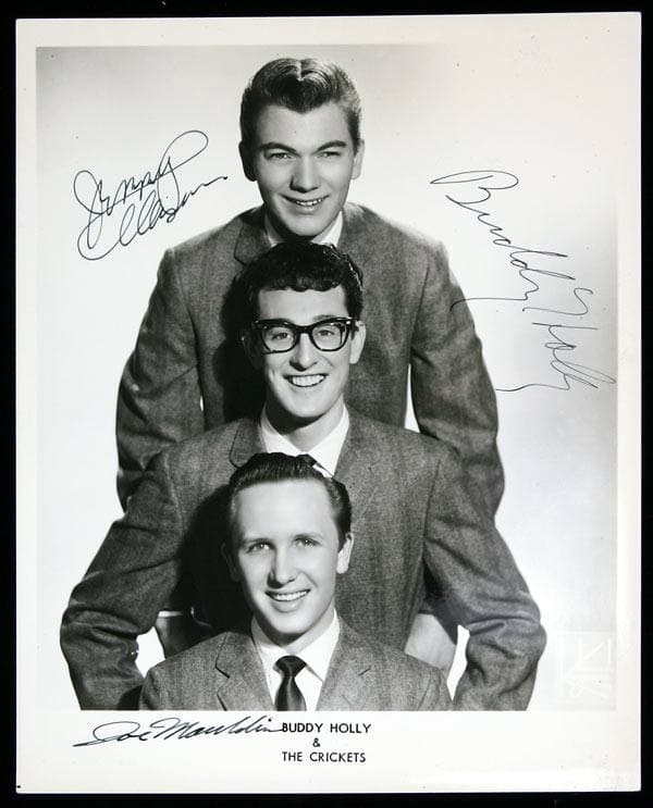 Buddy Holly and the Crickets in suits, posed together for a publicity portrait