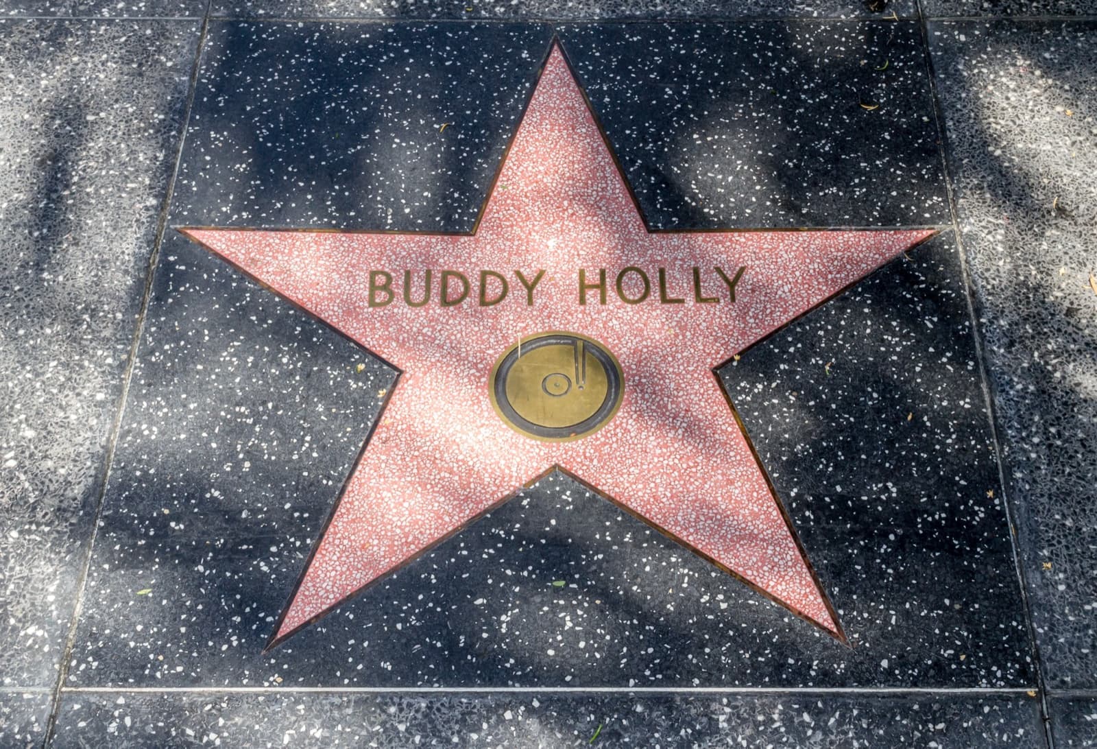 A terrazzo Walk of Fame star with a record emblem and the name Buddy Holly
