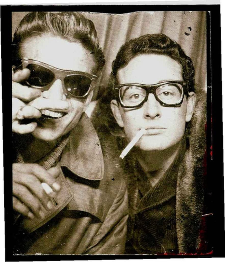Buddy Holly and Waylon Jennings side by side in a photo-booth picture