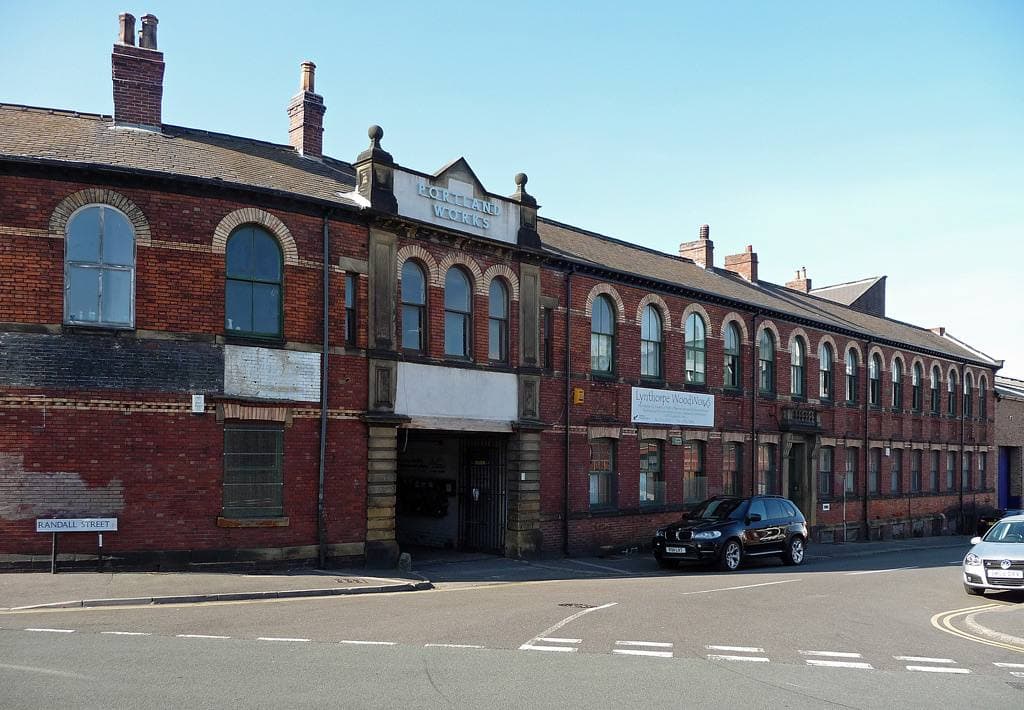 The red-brick front of Portland Works, a Victorian cutlery works on a Sheffield corner
