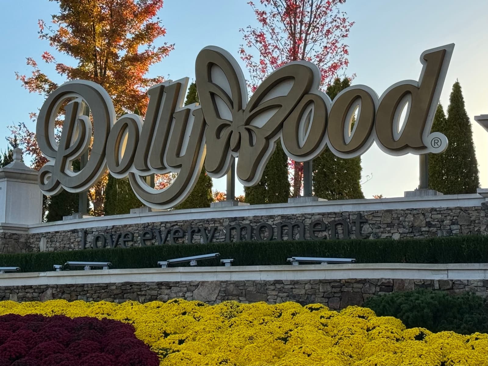 The Dollywood sign with a butterfly over the park entrance