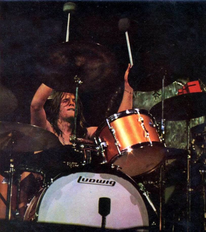 Carl Palmer with long hair, in a portrait photograph