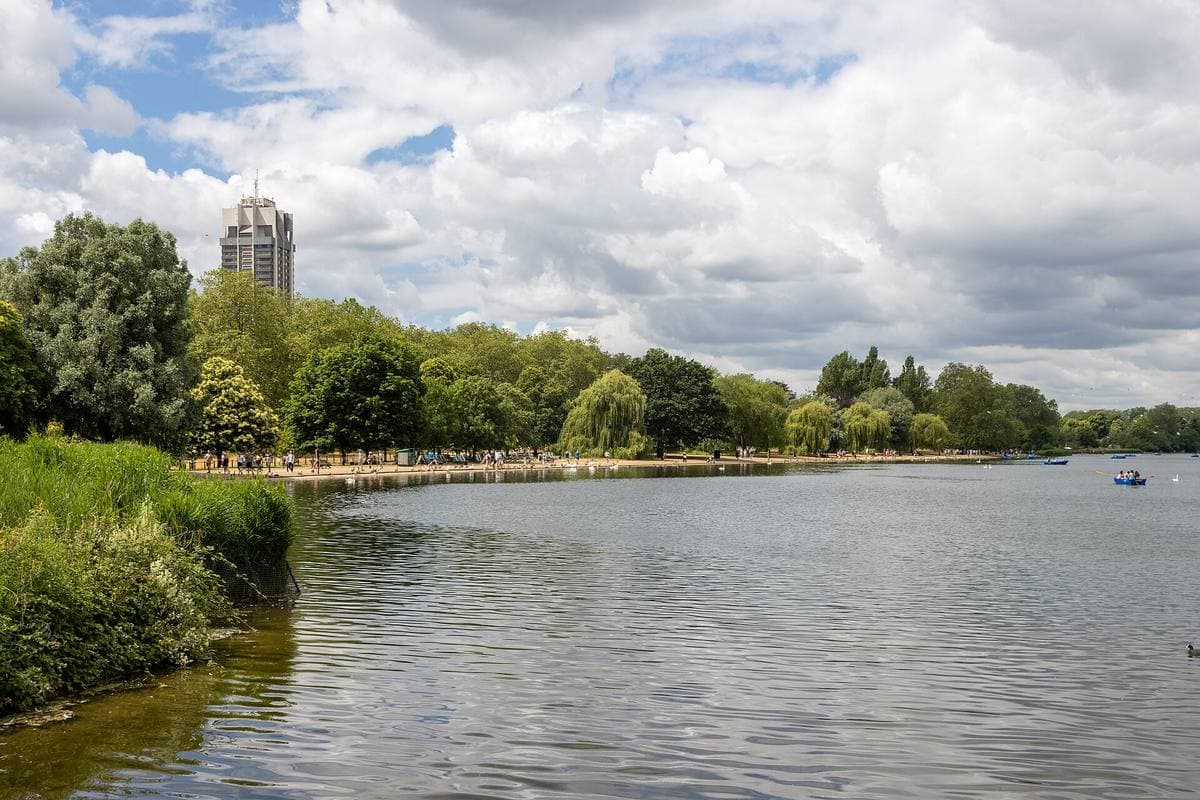 The Serpentine lake in Hyde Park under a cloudy sky