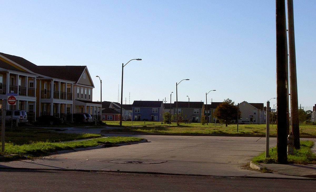 New two-storey housing along a broad empty street
