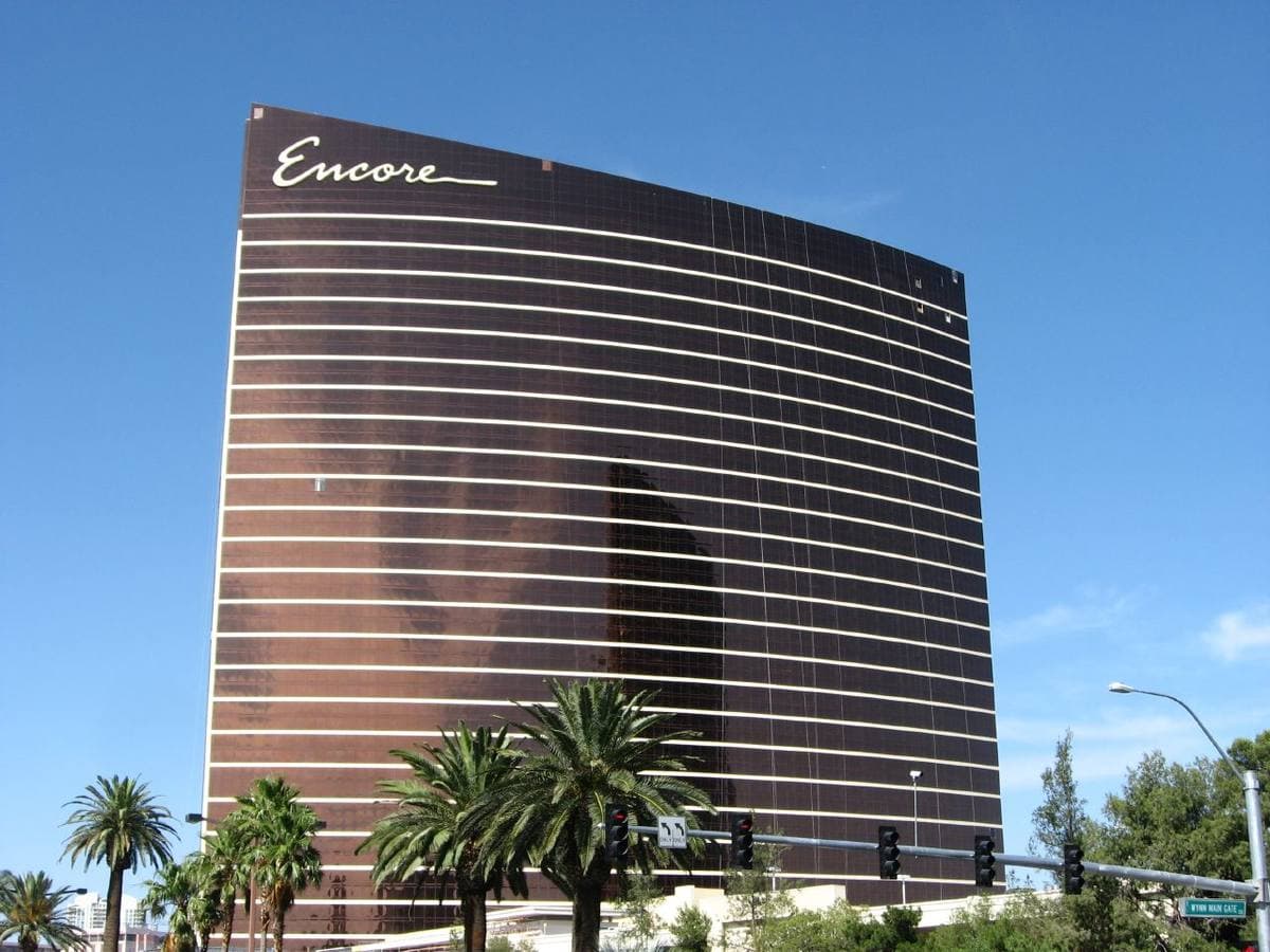 A tall curved bronze hotel tower on the Las Vegas Strip