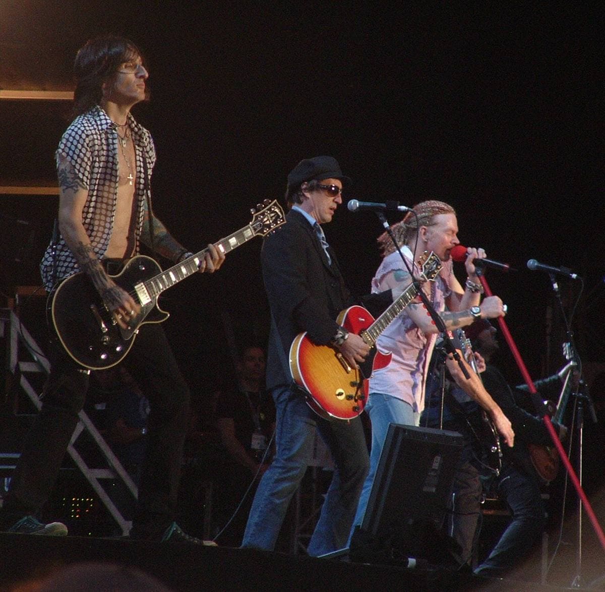 Three guitarists and a singer on the festival stage at Donington Park in 2006