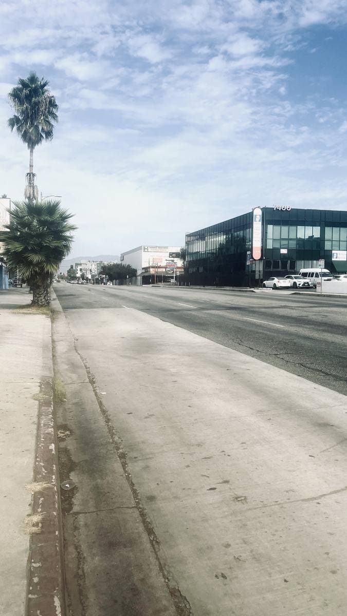 A wide boulevard in Van Nuys under a blue sky