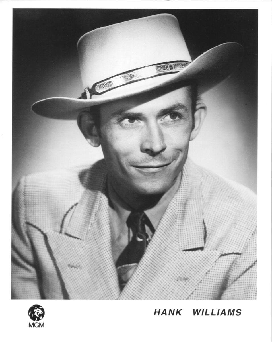 Hank Williams in a cowboy hat, head and shoulders, smiling slightly