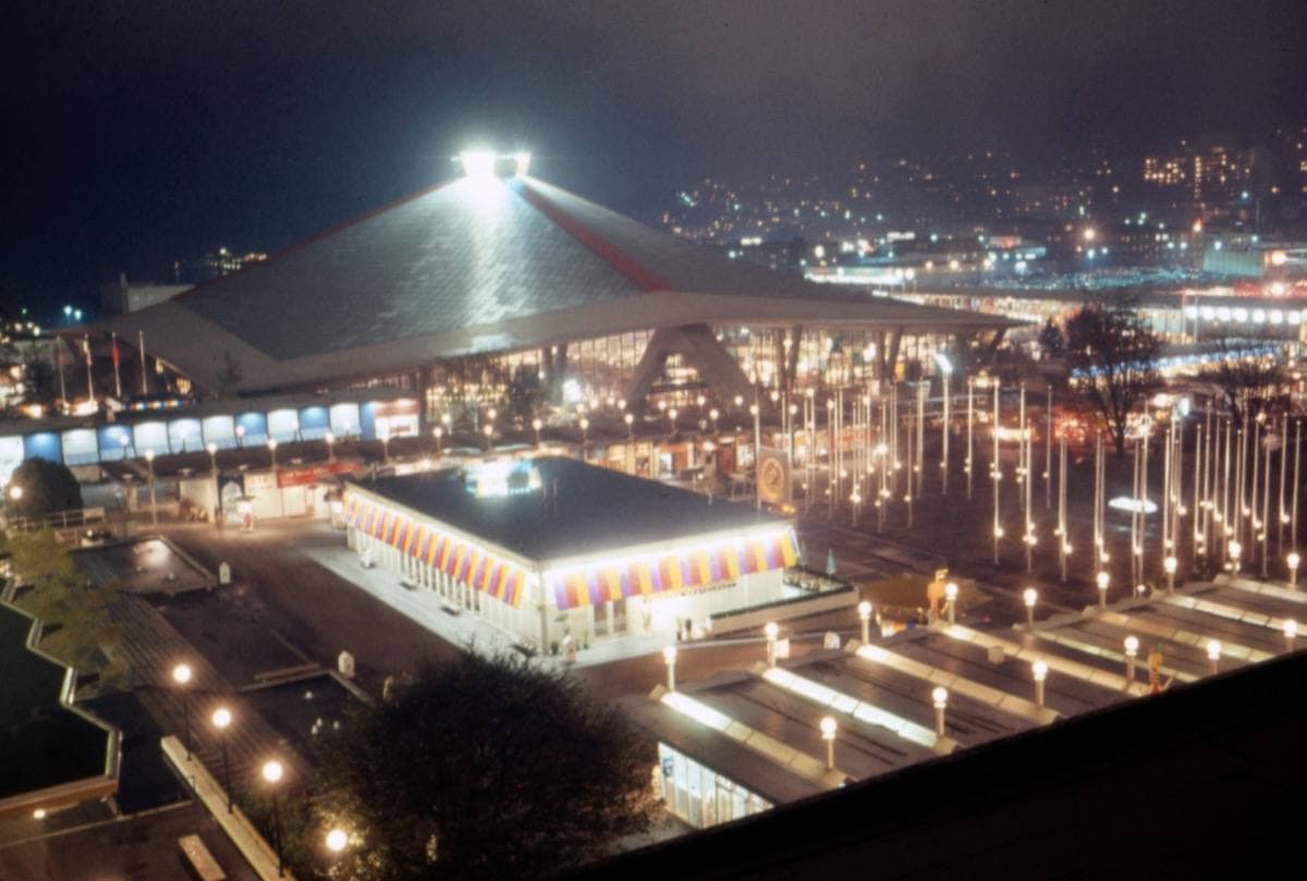 The Seattle Center Coliseum lit up at night in about 1963