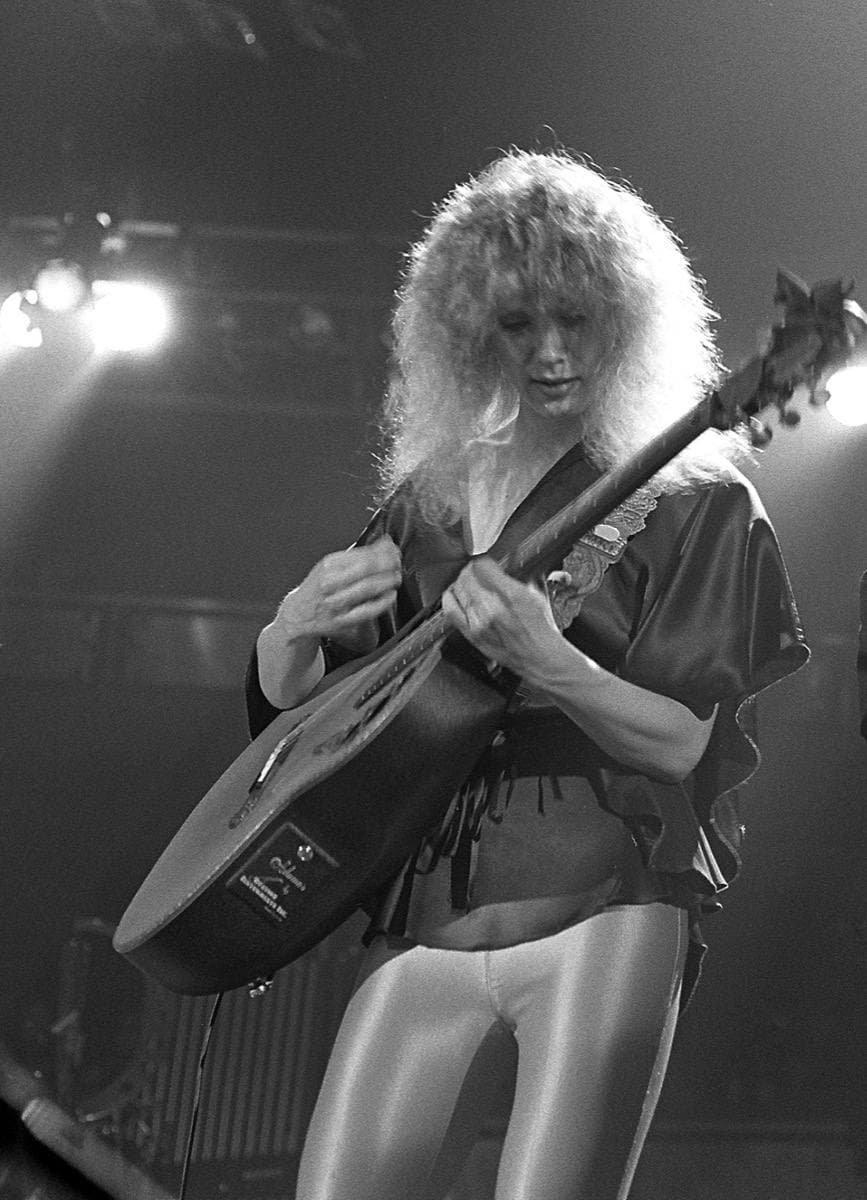 Nancy Wilson playing guitar on stage in 1978