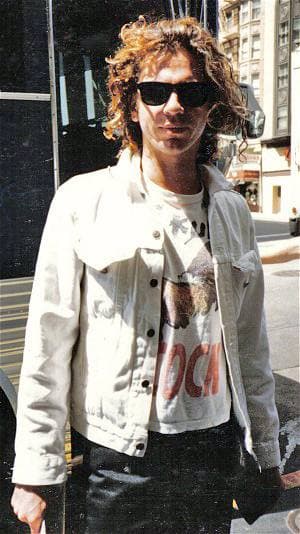 Michael Hutchence, long dark hair, in San Francisco in 1986