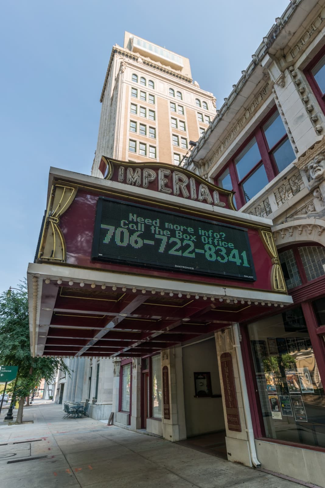 The Imperial Theatre marquee and vertical sign, looking up from the pavement