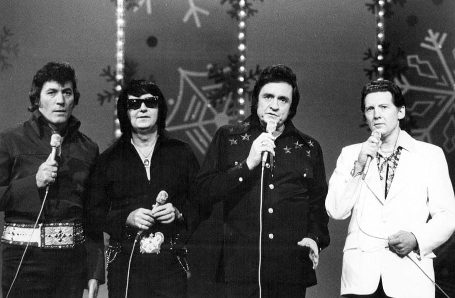 Four singers in a row on a television stage