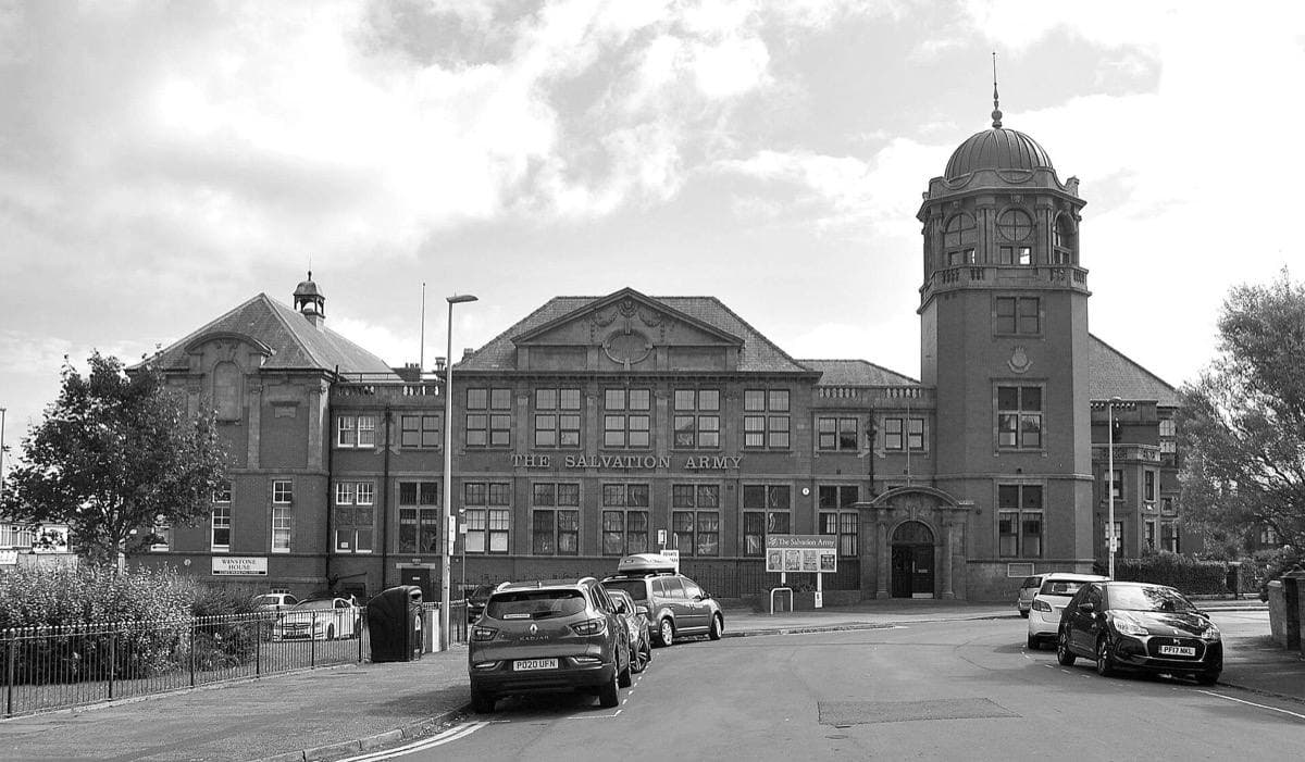 A red-brick and buff-stone Edwardian school building on a Blackpool street