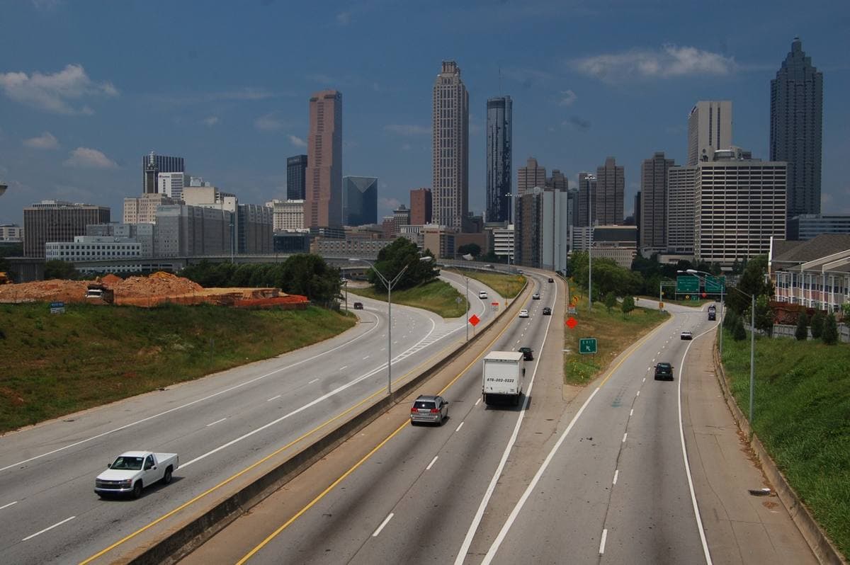 The downtown Atlanta skyline under a blue sky