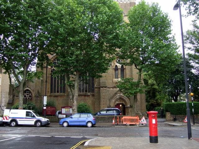 A Victorian stone church on a leafy Highbury street