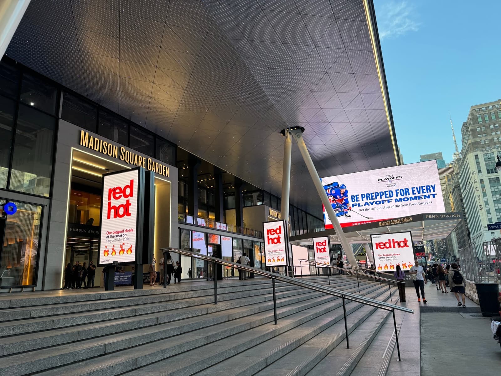 Steps up to the Madison Square Garden entrance under a broad canopy on Seventh Avenue