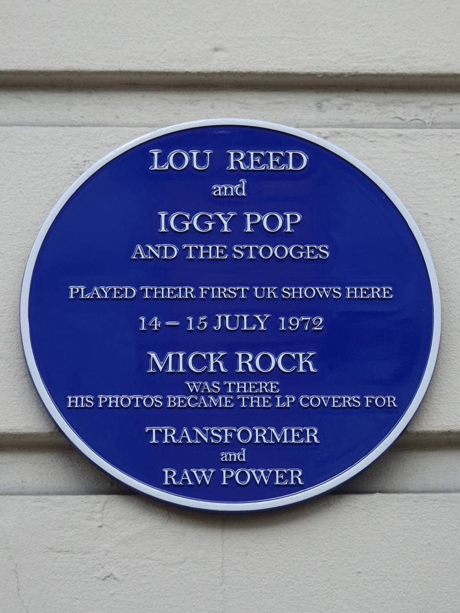 A round blue plaque naming Lou Reed, Iggy Pop and the Stooges, Mick Rock, Transformer and Raw Power