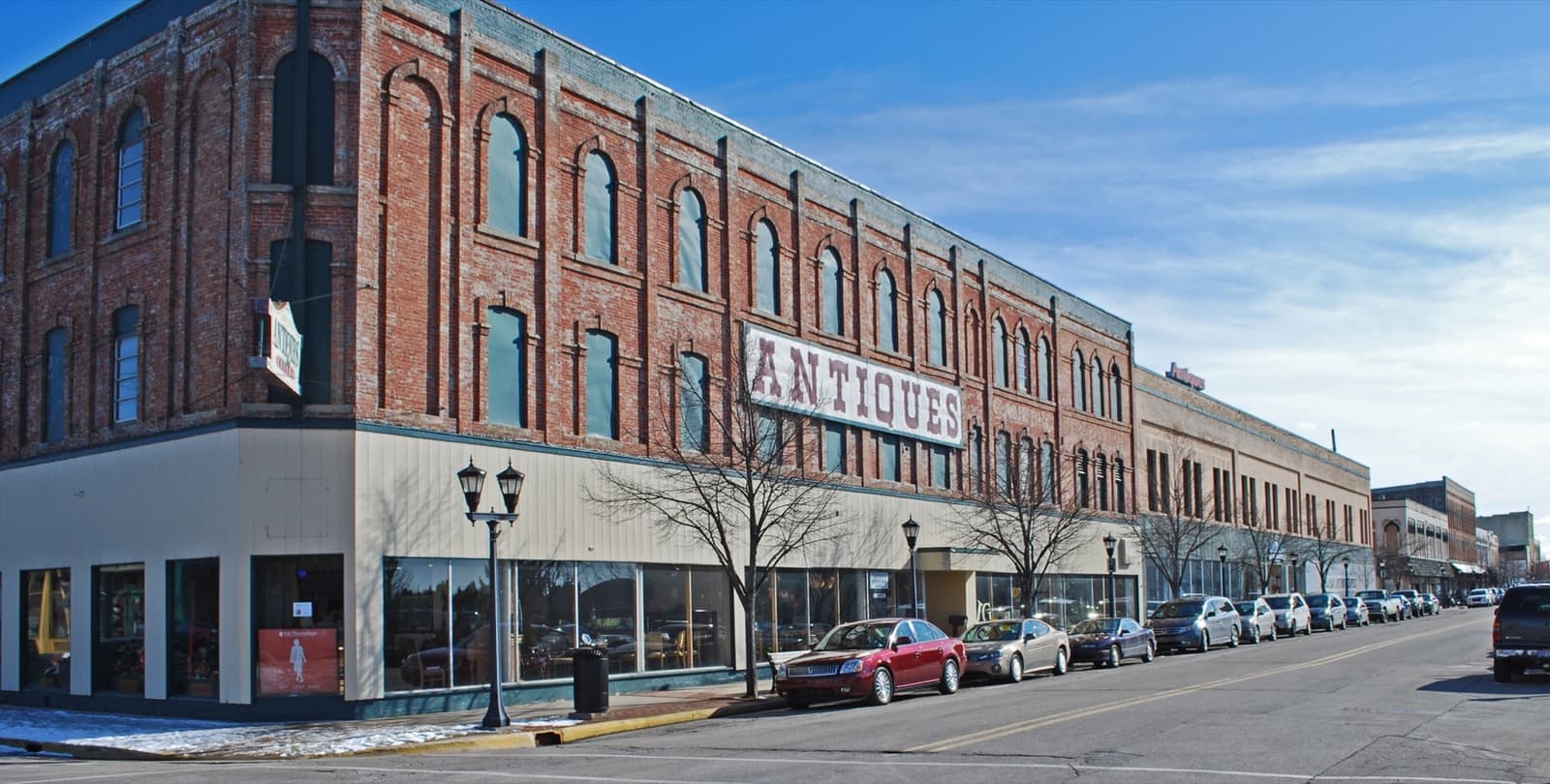 Red-brick commercial buildings along a street in downtown Bay City