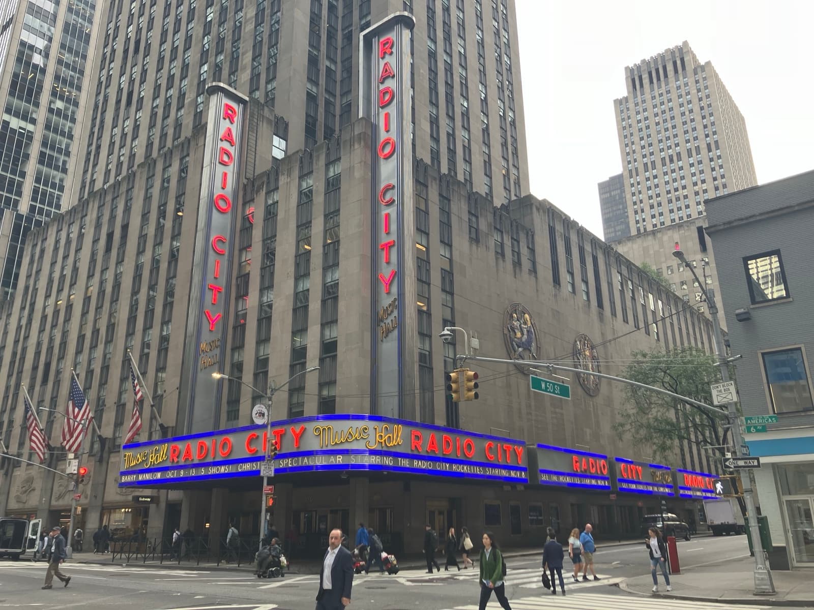 The vertical Radio City sign and neon marquee on Sixth Avenue
