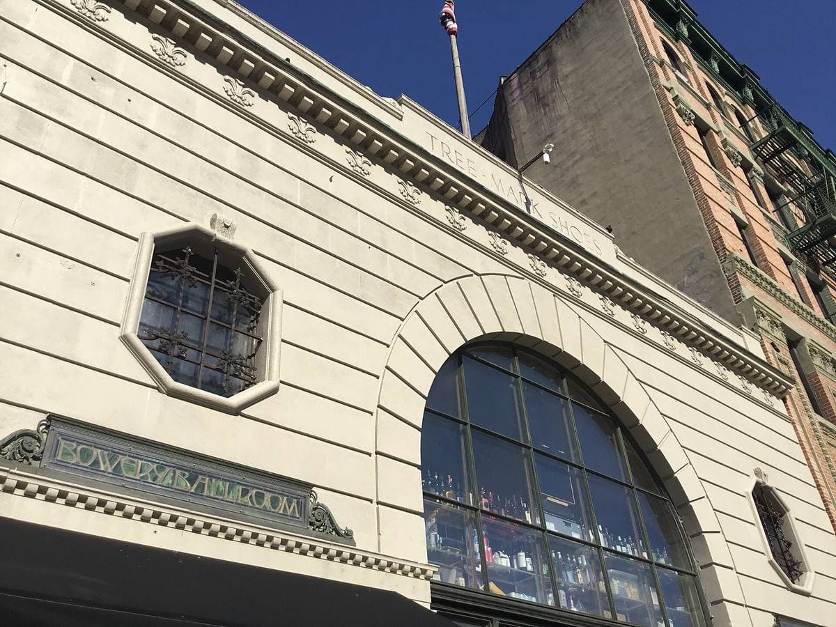 A cream stone front with an octagonal window and Bowery Ballroom carved above the doors