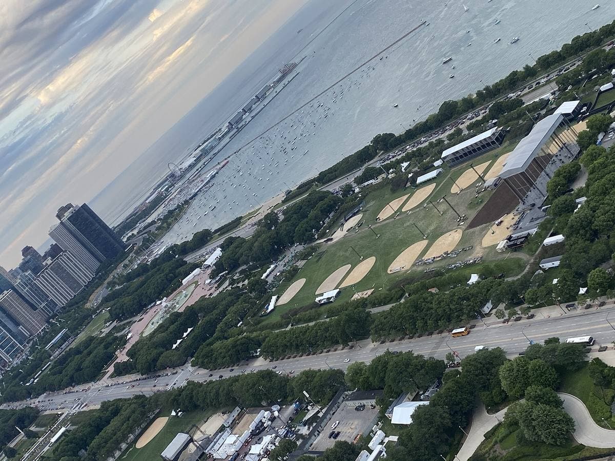 Grant Park from a high window, festival stages laid out in the green park beside the lake