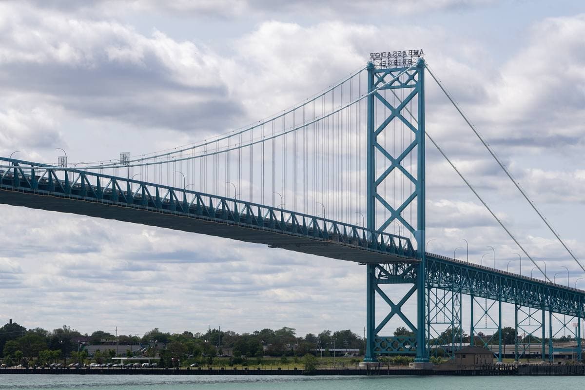 A suspension bridge over the Detroit River seen from Windsor
