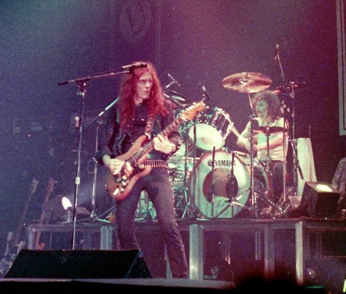 Eddie Clarke playing guitar on stage in 1982
