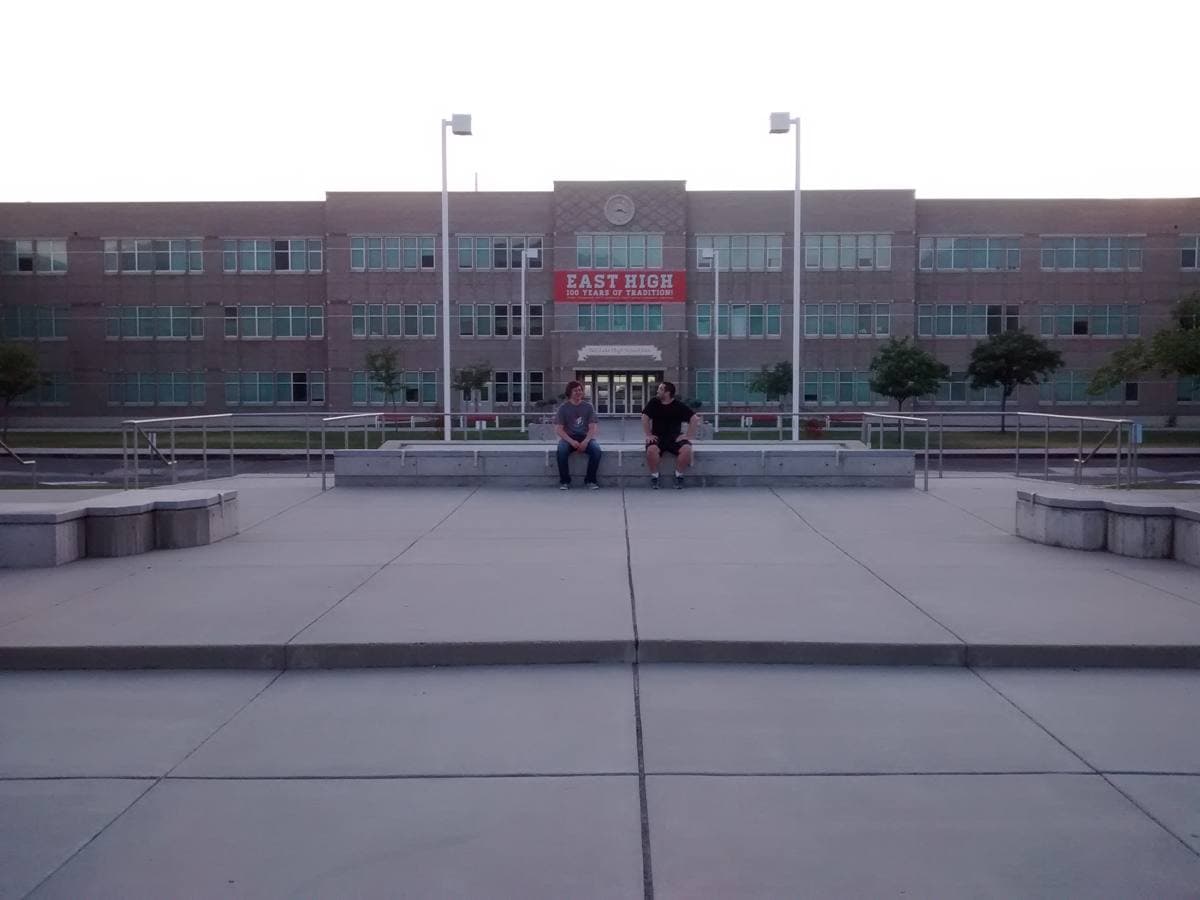 The front of East High School, Salt Lake City, a brick building with a lawn