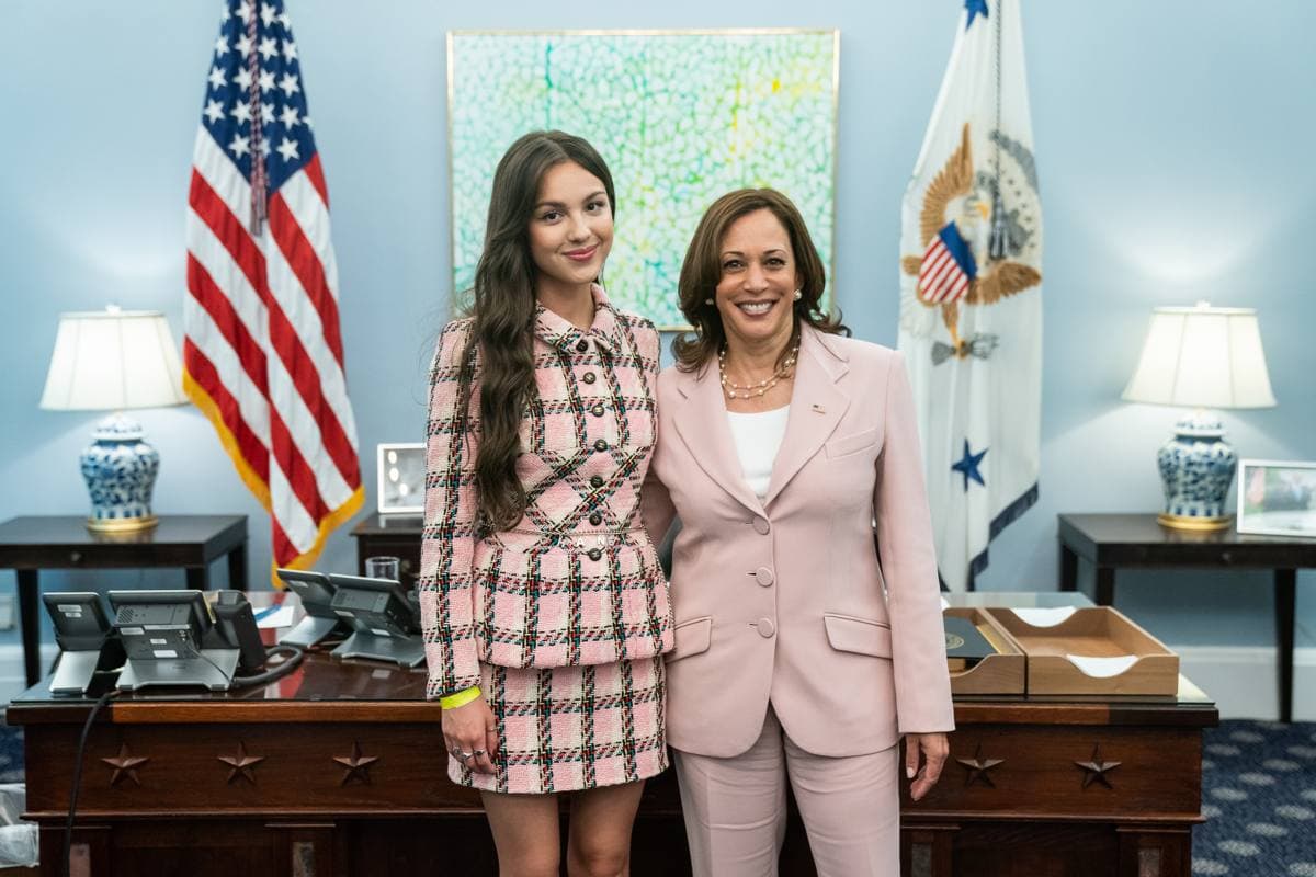 Kamala Harris and Olivia Rodrigo posing together in a West Wing office