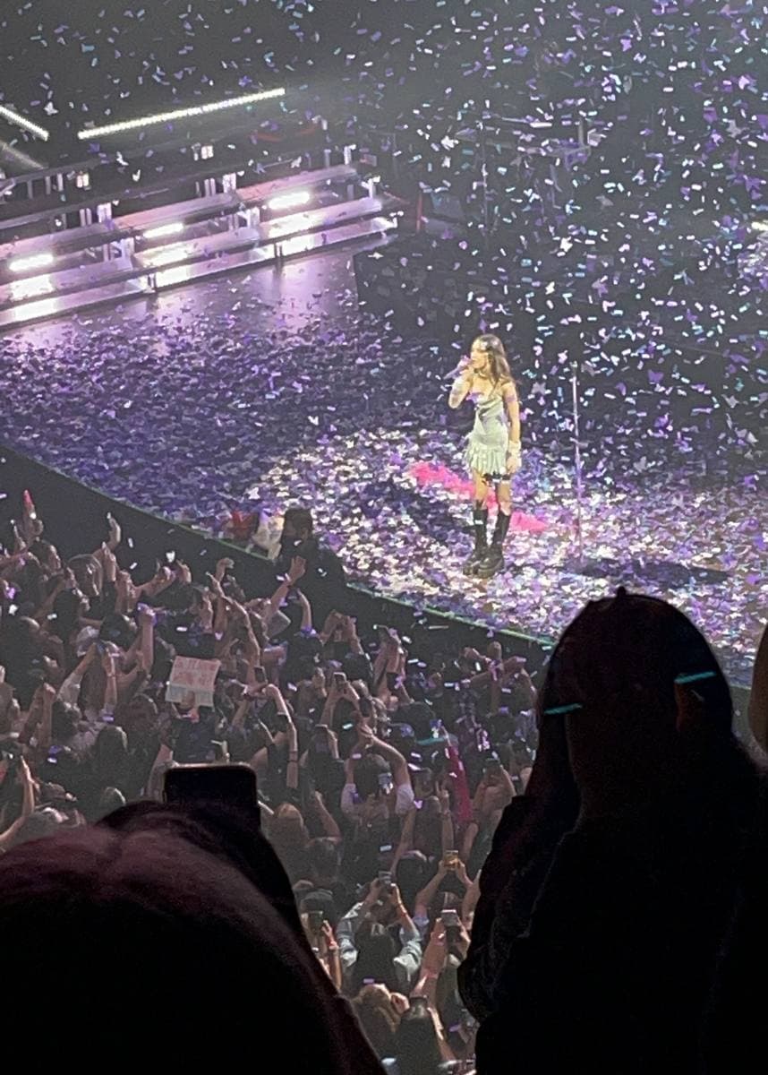 Olivia Rodrigo singing on stage in 2022