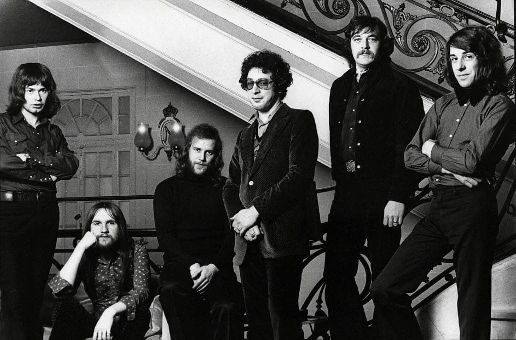 Six men in a 1973 group publicity photograph