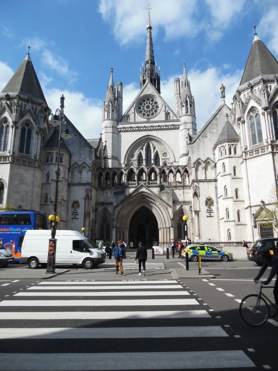 The Gothic stone front and towers of the law courts