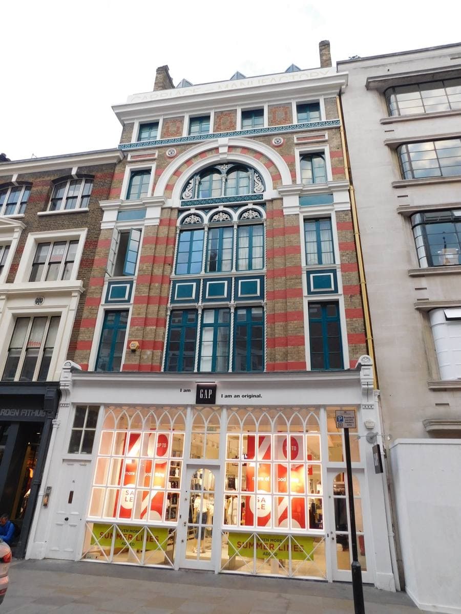 The Gap at 30–31 Long Acre, Covent Garden: a tall Victorian building of striped brick with arched windows above a shop front