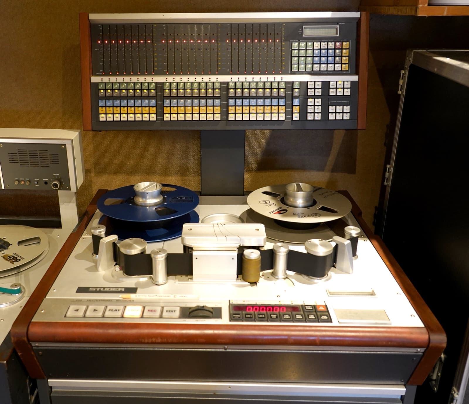 A large reel-to-reel tape machine in a studio