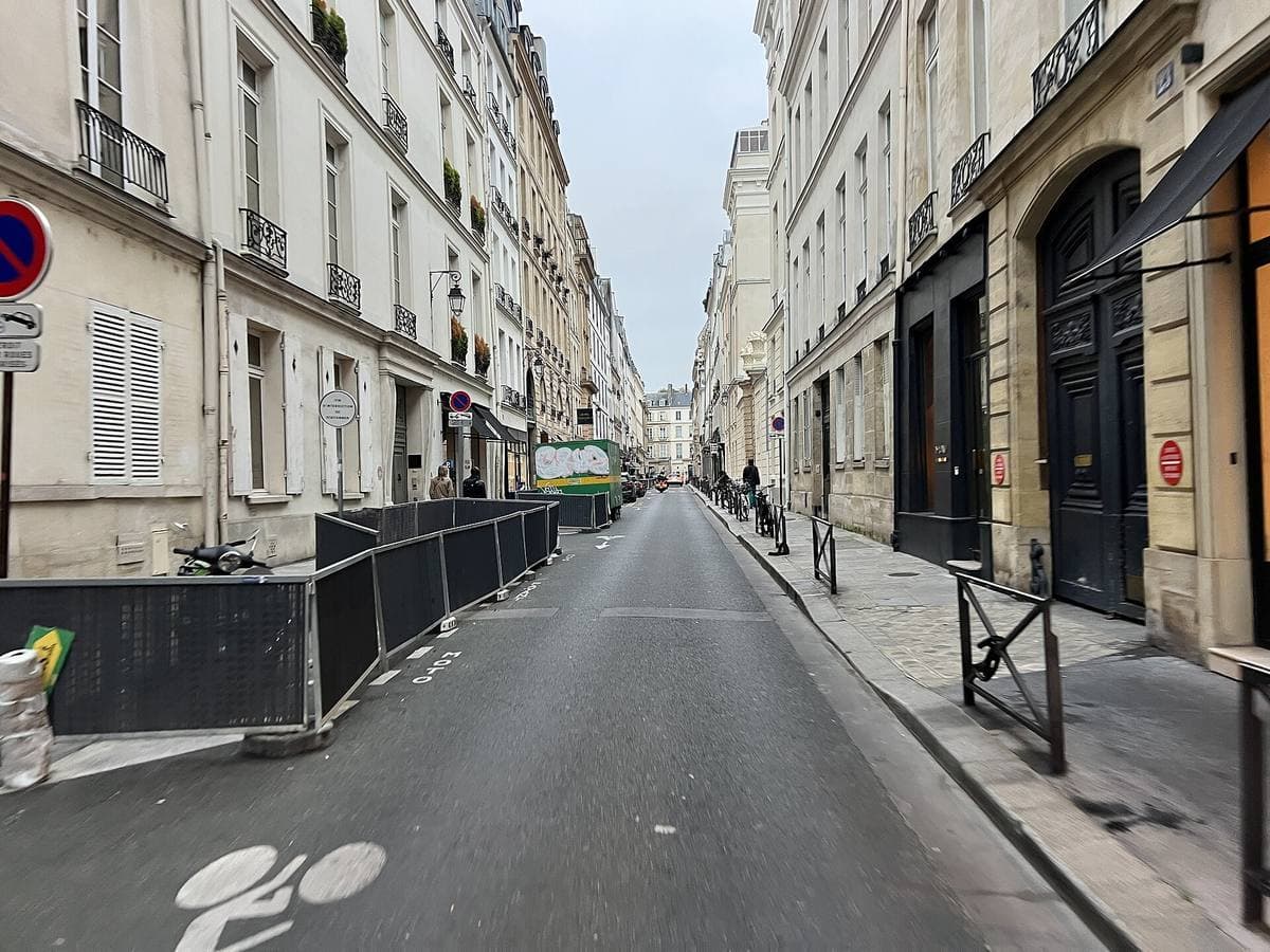 A quiet Left Bank street of pale stone buildings