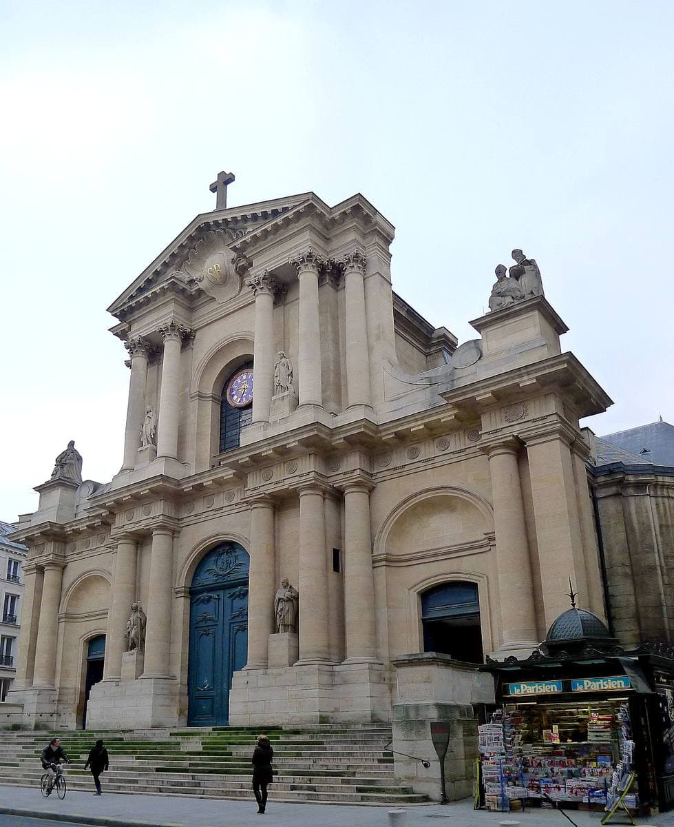 A classical church front with columns and steps