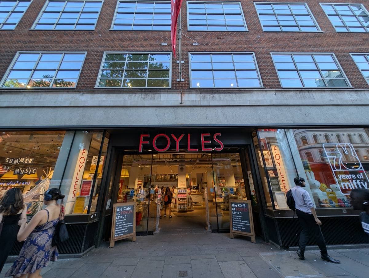 The glass-fronted Foyles bookshop on Charing Cross Road, people at the door