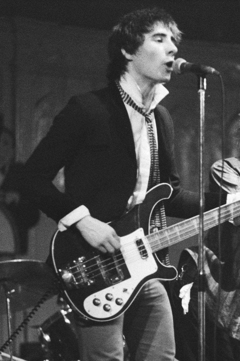 Glen Matlock singing backing vocals and playing bass, black and white