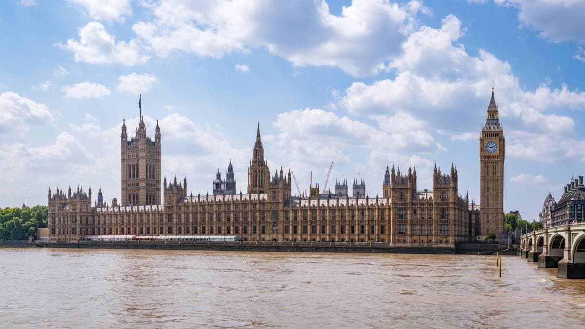 The Houses of Parliament and Big Ben across a wide brown river