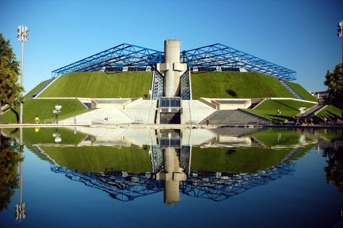 A pyramid-shaped arena with grass walls in Paris