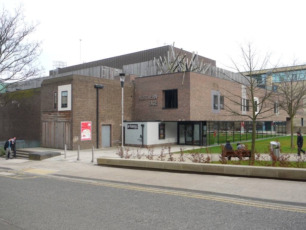 A modern theatre building with a glass front on a Newcastle street