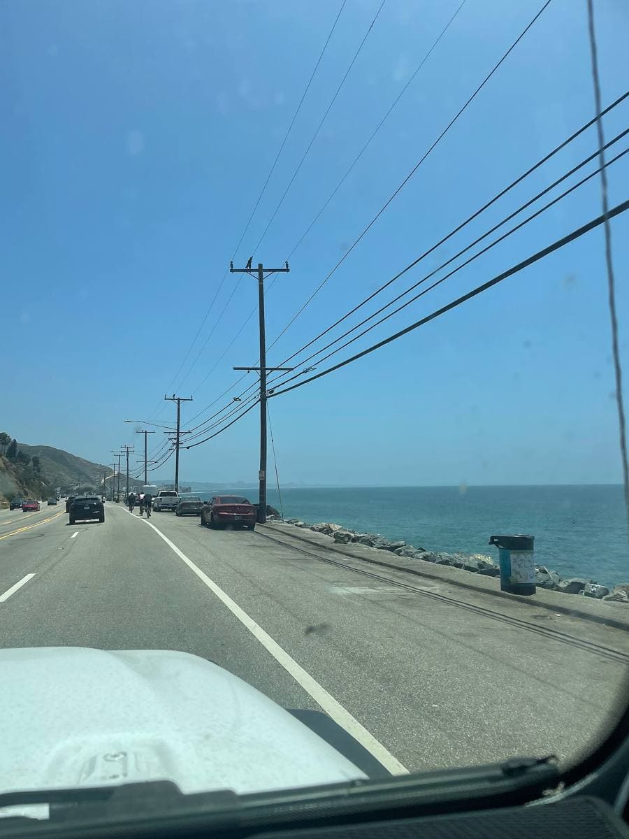 The coast highway in Malibu with hills and sea