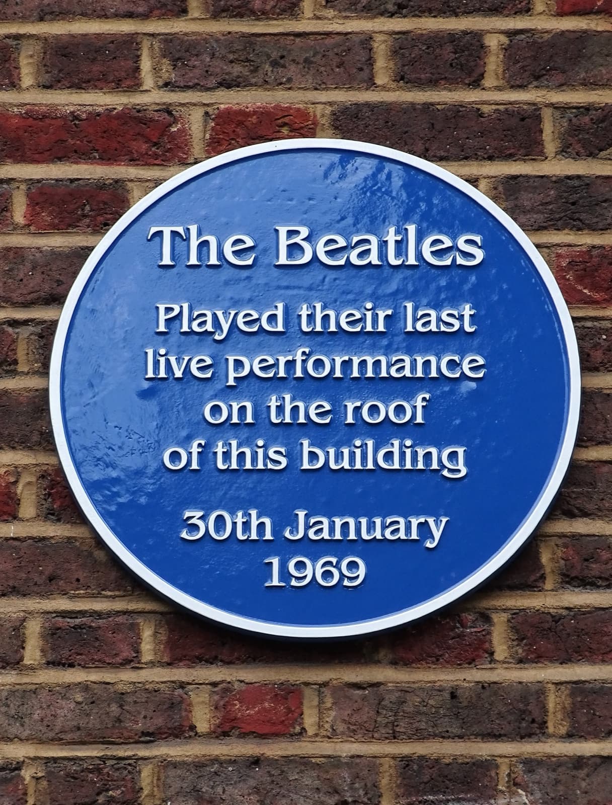 A blue plaque recording the last live performance on the roof