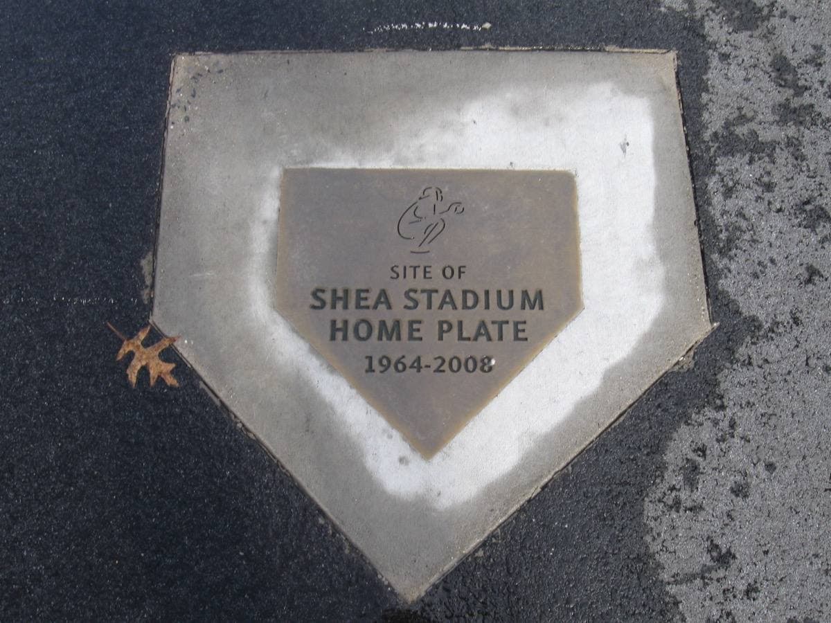 A home-plate shaped plaque set in asphalt