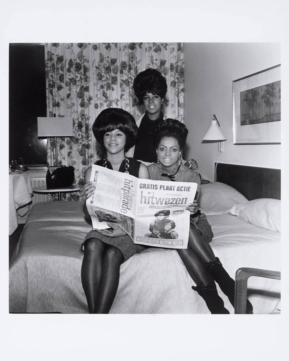 The three Supremes holding a Dutch pop magazine in 1964