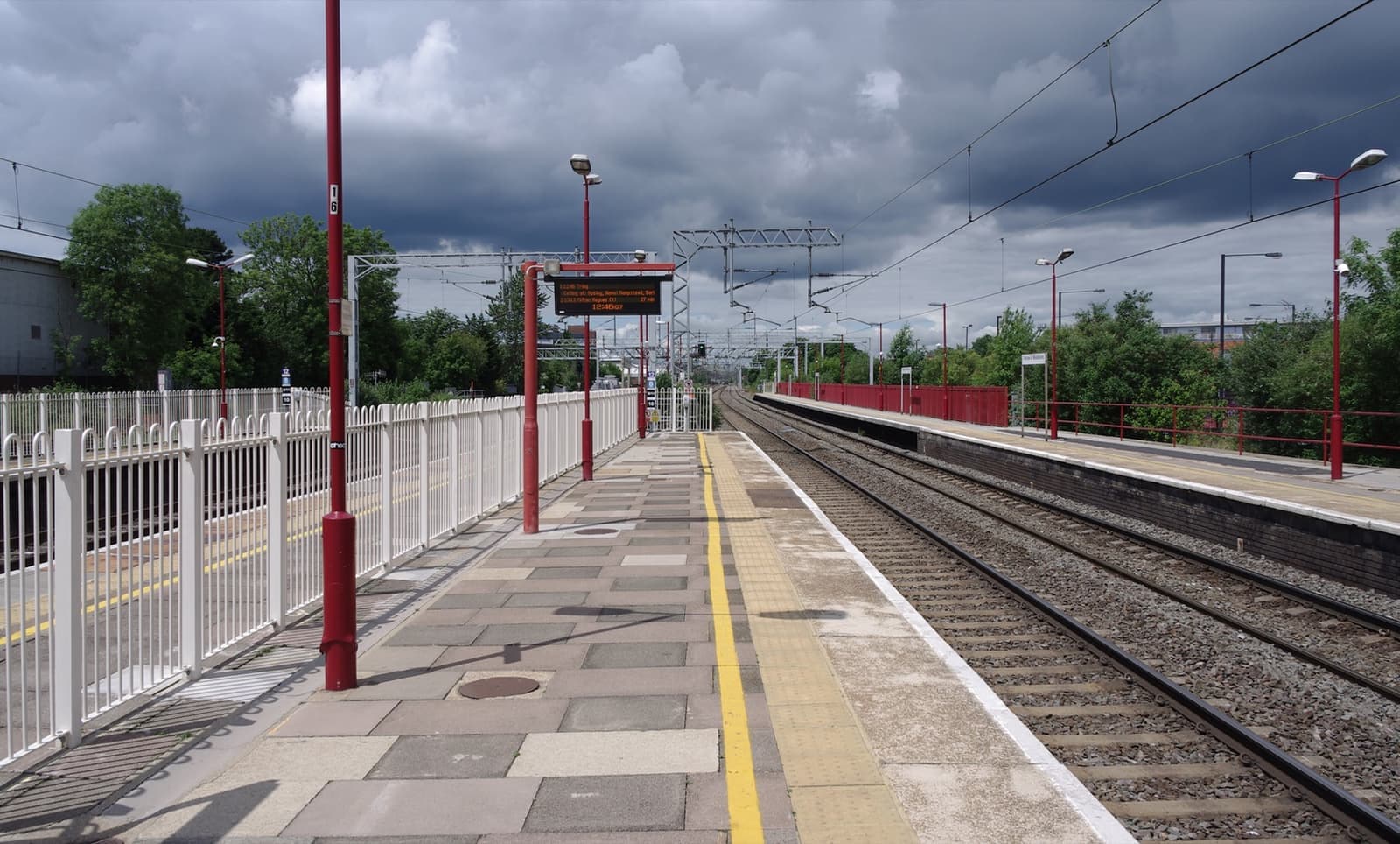 The brick station building at Harrow & Wealdstone under heavy cloud