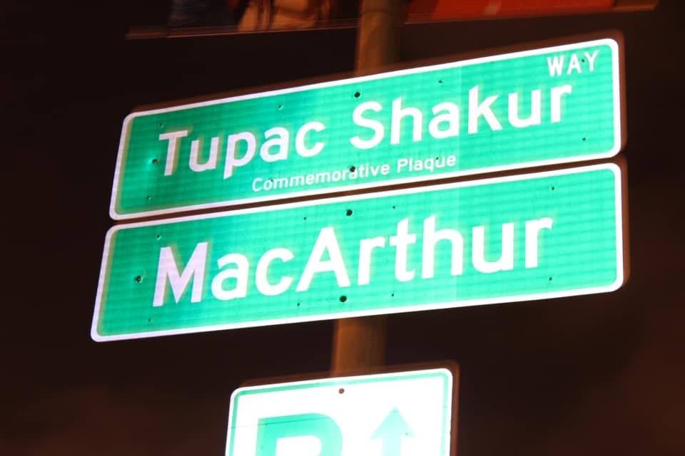 A street sign reading Tupac Shakur Way on MacArthur Boulevard