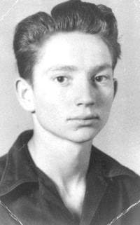 A teenage Willie Nelson in a dark shirt, his hair combed up, looking at the camera