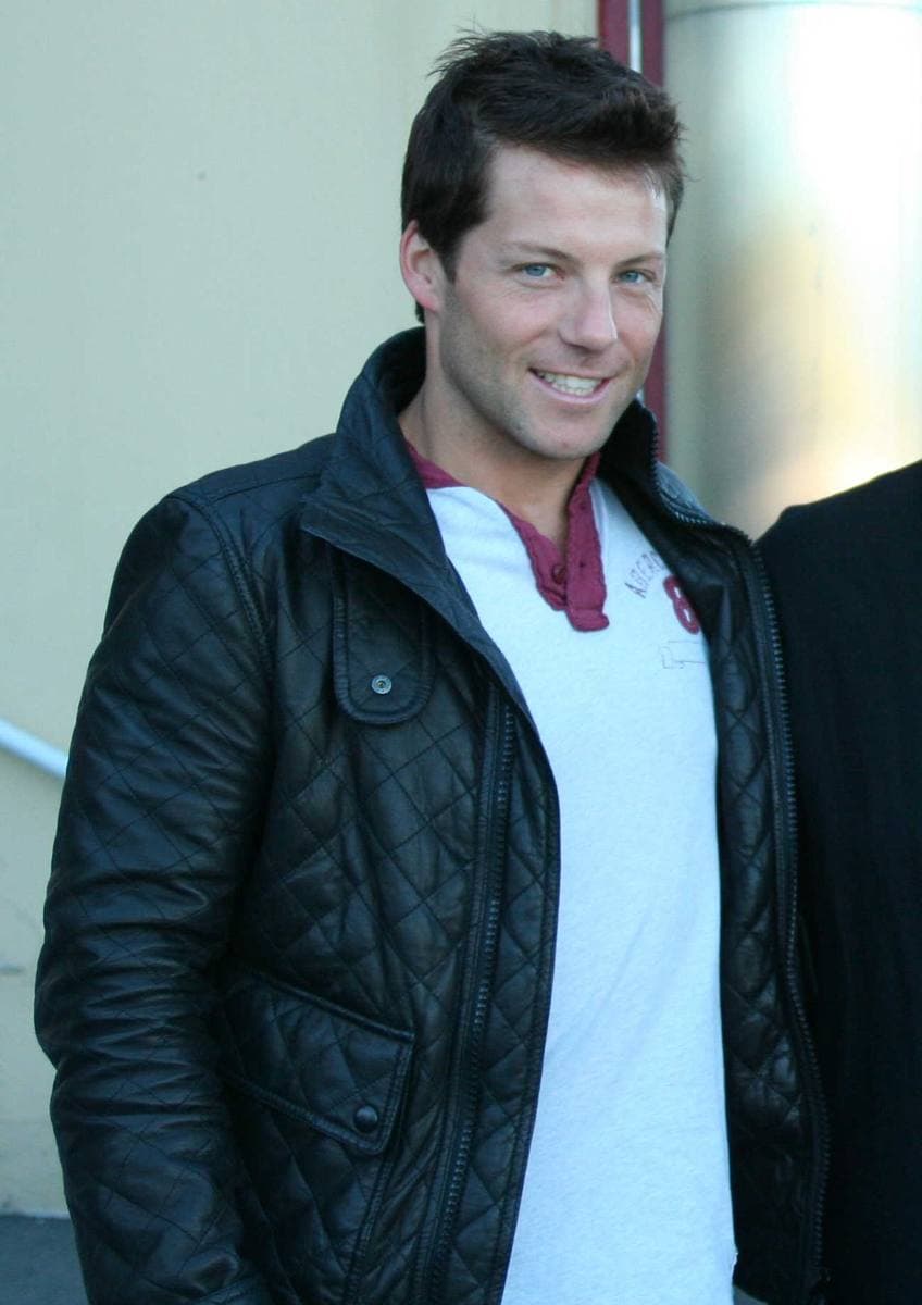 A man with short brown hair smiling